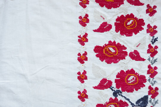 Fabric background with embroidered national ethnic ornament. Ukrainian culture.