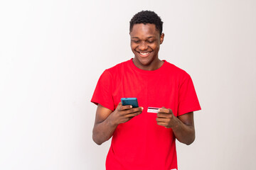 young black man using his phone and credit card