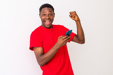 excited young black man checking his smartphone