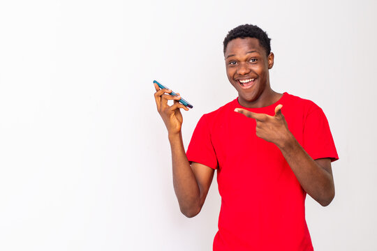 young black man making a phone call feeling excited