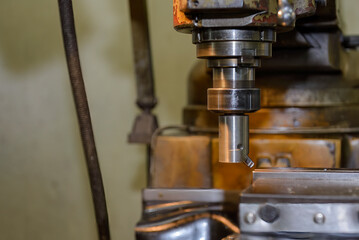 The NC milling machine face milling the metal parts.