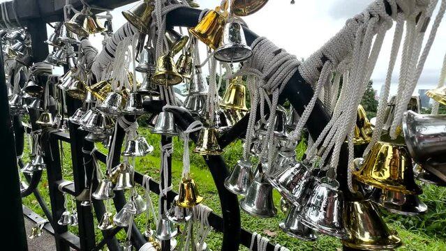 Wishing Bells On Railing At Mount Faber Park In Singapore. closeup shot