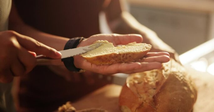 Couple, hands and bread with butter, spread or roll for meal, snack or wheat in kitchen at home. Closeup of hungry people making food in morning for breakfast, bun or healthy nutrition on table