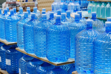 Bottles with clean water in a hyper package. Sale of drinking water