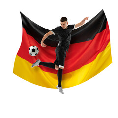Competitive man, soccer player in black uniform playing, dribbling ball against white background...