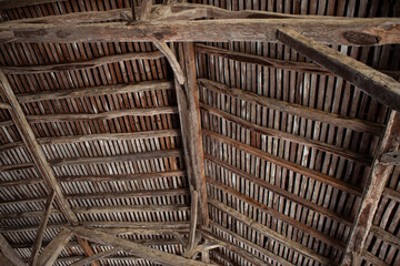 Wooden beams in an old barn - 728630015