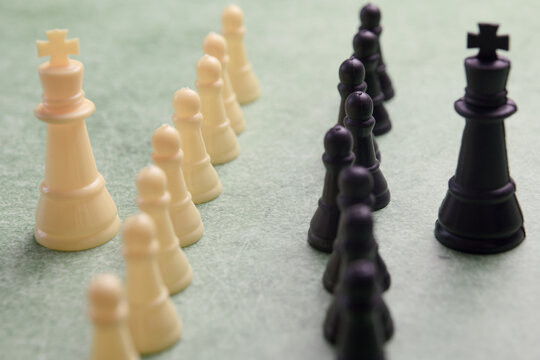 chess pieces on a green background, closeup of photo