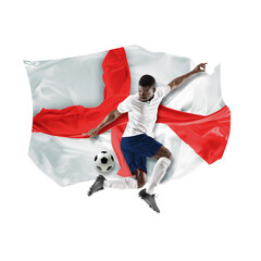 Concentrated African man, soccer player in uniform playing, hitting ball over white background with...