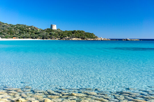 Cala Pira beach and tower, with white sand and crystal clear water. Castiadas, Sardinia, Italy