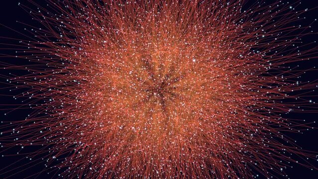 A vibrant explosion of red and orange sparks light up the night sky in this mesmerizing firework display, captivating with its dazzling colors and dynamic motion