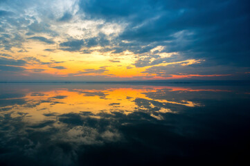 Cloud reflection at sunset on lake Neusiedlersee in Burgenland Austria