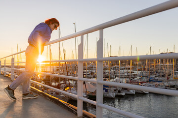 Red Hair Woman Smiling Looking at Camera at Sunset with Blue Jacket