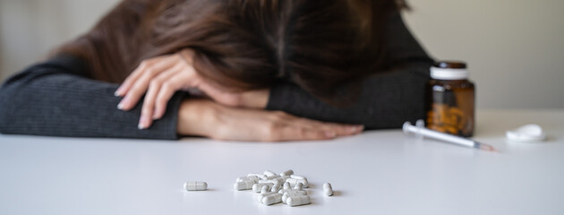 close up hand of young women. Stressed female taking drug overdose.