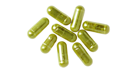 Top view of Herb capsules . Green pills isolated on white 