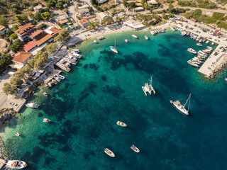  Port on a Greek island with blue turquoise water with many boats and yachts on the water in...