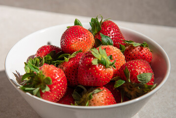 Fresh strawberry in white bowl