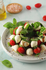 A plate with Italian salad caprese canape