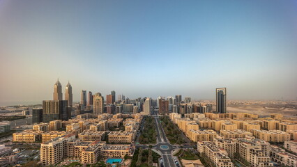 Panorama of skyscrapers in Barsha Heights district and low rise buildings in Greens district aerial all day timelapse.