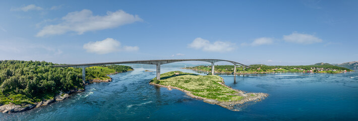 A sweeping drone super panorama captures the Saltstraumen Bridge arching over the world's strongest...