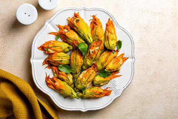 Zucchini Flowers stuffed with ricotta cheese, egg and bread crumbs, parsley. Oven baked courgette...