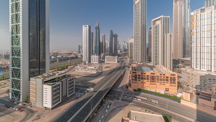 Fototapeta na wymiar Aerial view of Dubai Downtown skyline with many towers all day timelapse.