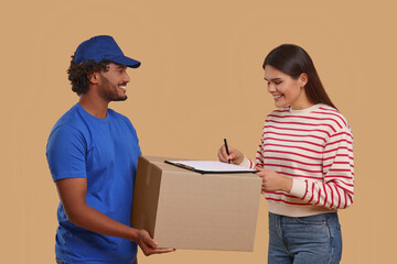 Smiling woman signing order receipt on light brown background. Courier delivery