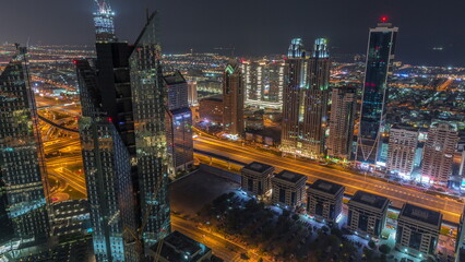 High-rise buildings on Sheikh Zayed Road in Dubai aerial all night timelapse, UAE.