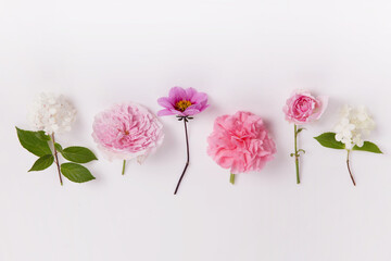 Festive floral arrangement of English rose, hydrangea, dahlia on a white background.