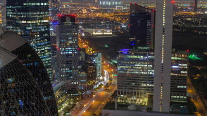 Skyline view of the high-rise buildings in International Financial Centre in Dubai aerial all night timelapse, UAE.