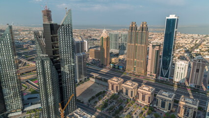 Fototapeta na wymiar High-rise buildings on Sheikh Zayed Road in Dubai aerial morning timelapse, UAE.