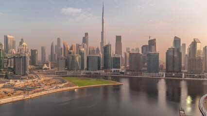 Aerial view to Dubai Business Bay and Downtown with the various skyscrapers and towers timelapse