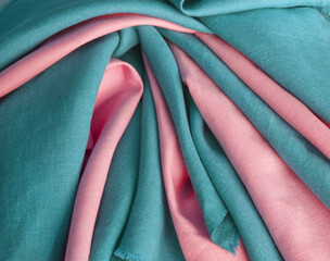 Blue and pink draped linen fabric. Woven  texture background. Various colors textile drapery for...