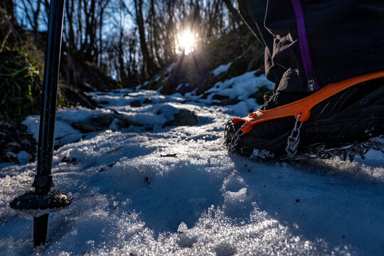 Trekking boots on a trail in winter