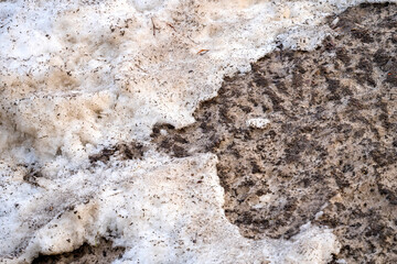 The texture of dirty snow, the snow thawing.