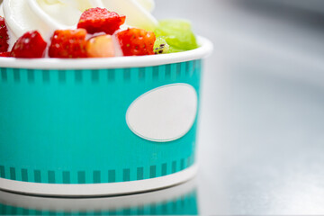 Yogurt soft ice cream gelato natural with strawberry and kiwi closeup