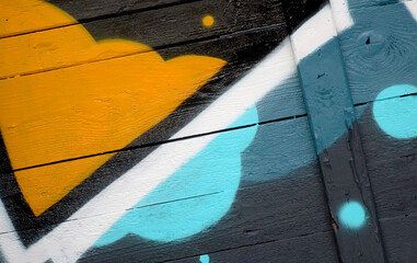 Colorful background of graffiti painting artwork with bright aerosol outlines on wall. Old school...