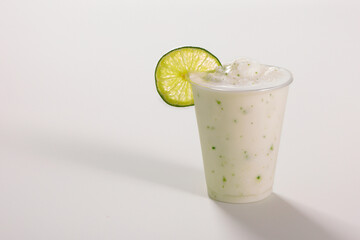 Refreshing iced natural lemon smoothie decorated