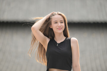 A young woman with his hairstyle and the atmosphere of living in the community.