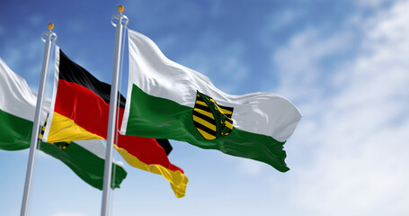 The flag of Saxony waving in the wind on a clear day