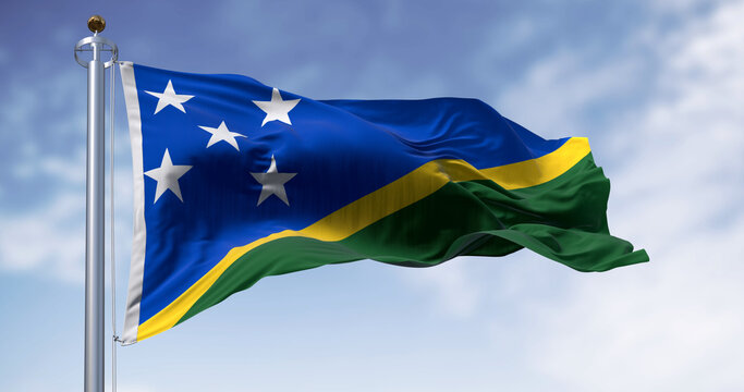 Detail of the national flag of Solomon Islands waving in the wind on a clear day
