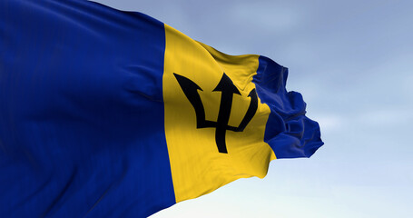 Close-up of Barbados national flag waving in the wind on a clear day