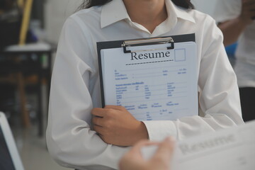 Close up view of job interview in office, focus on resume writing tips, employer reviewing good cv...