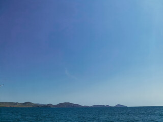 Sunny Summer Landscape of Sea, Mountains, and Sky with No People