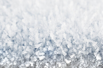 Natural winter background, snow surface and texture close up. Copy space for text