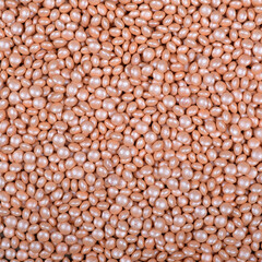 Colorful and bright cake decorations, in powder and granule form, can also be used as a colorful background.