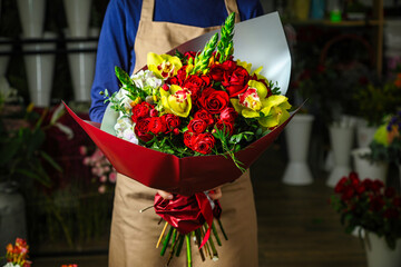 Man Holding Red and Yellow Flower Bouquet, With Copy Space