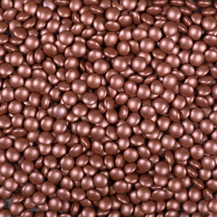 Colorful and bright cake decorations, in powder and granule form, can also be used as a colorful background.