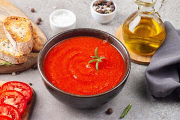 Tomato soup or sauce with rosemary.  Healthy, vegan and dieting lunch and dinner concept. Gazpacho. 