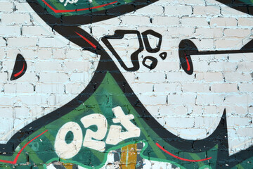 Colorful background of graffiti painting artwork with bright aerosol outlines on wall. Old school street art piece made with aerosol spray paint cans. Contemporary youth culture backdrop