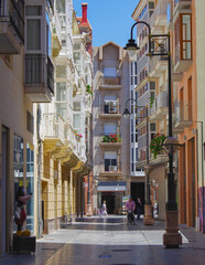 Romantic backstreet, side street and alleys in historic old town of Cartagena, Spain with historic...